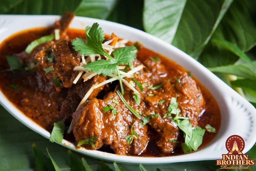 Lamb rogan josh in a rich Kashmiri gravy, topped with coriander and ginger